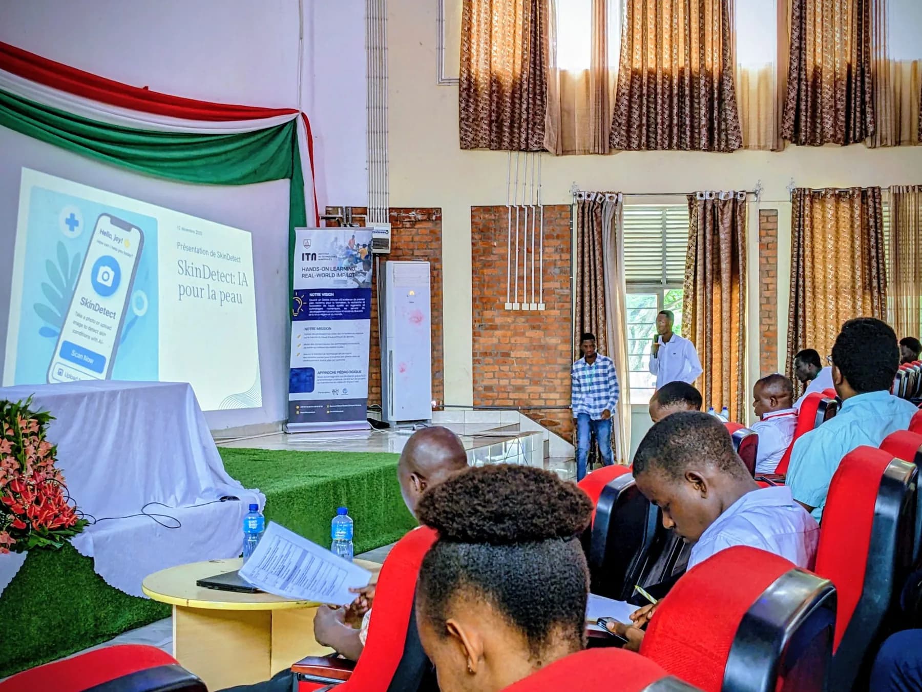 A researcher presenting an AI health project to participants in 2025